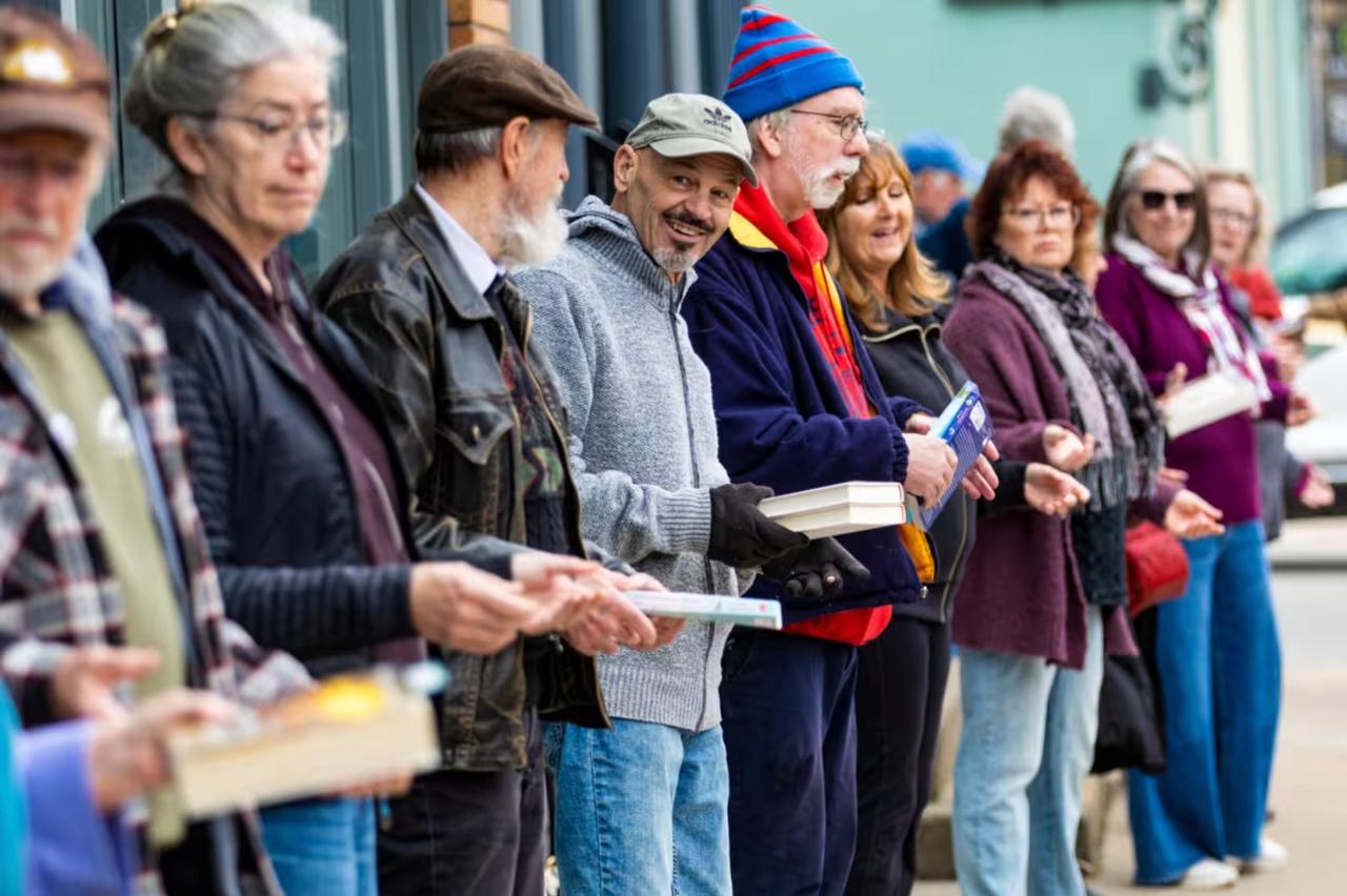 An image of the "book brigade" for Serendipity Books in Chelsea, Michigan